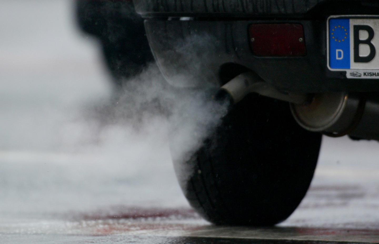 FILE PHOTO: Emissions well out of an exhaust in downtown Berlin.