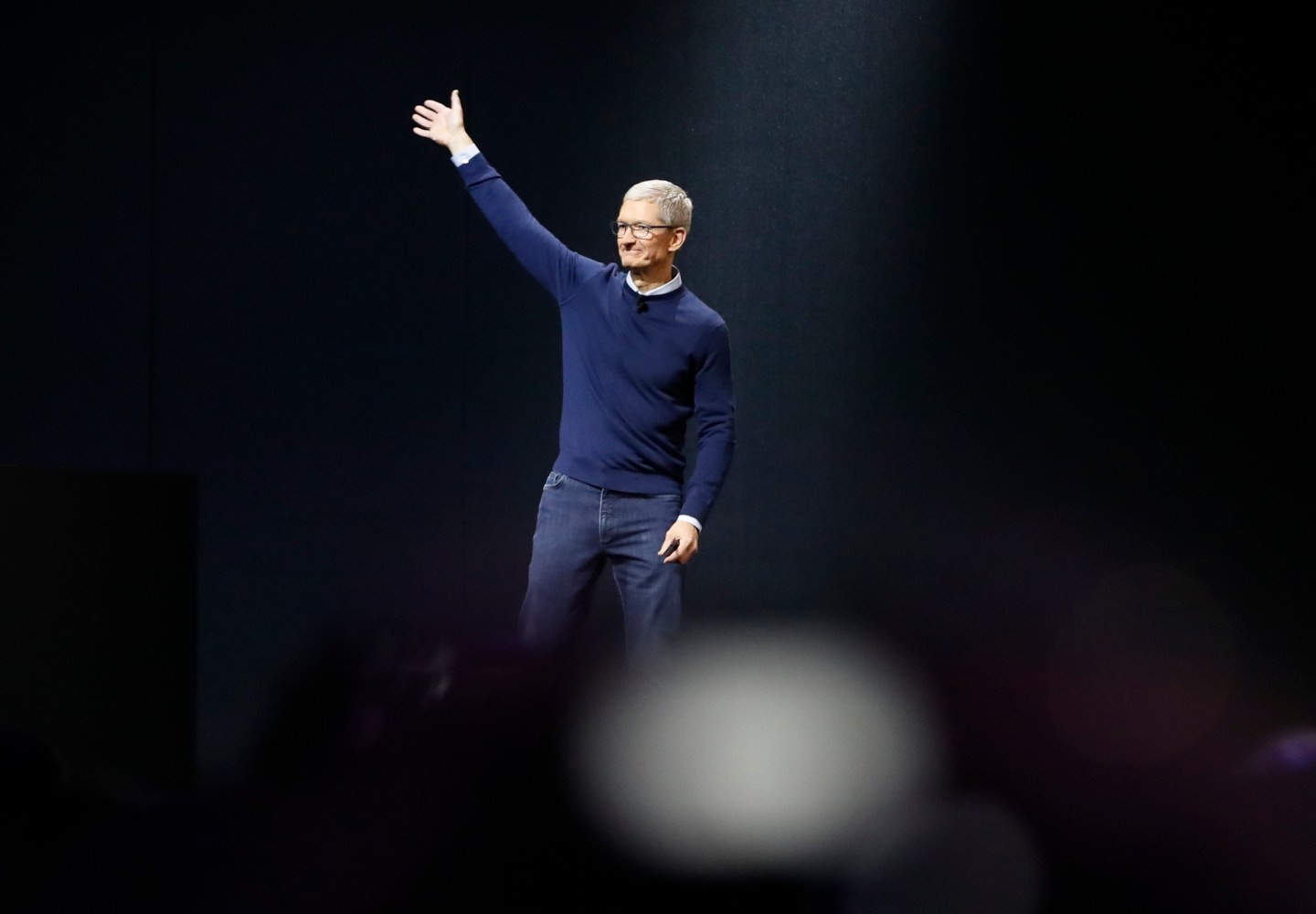 Tim Cook waves during Apple's annual developer conference in San Jose