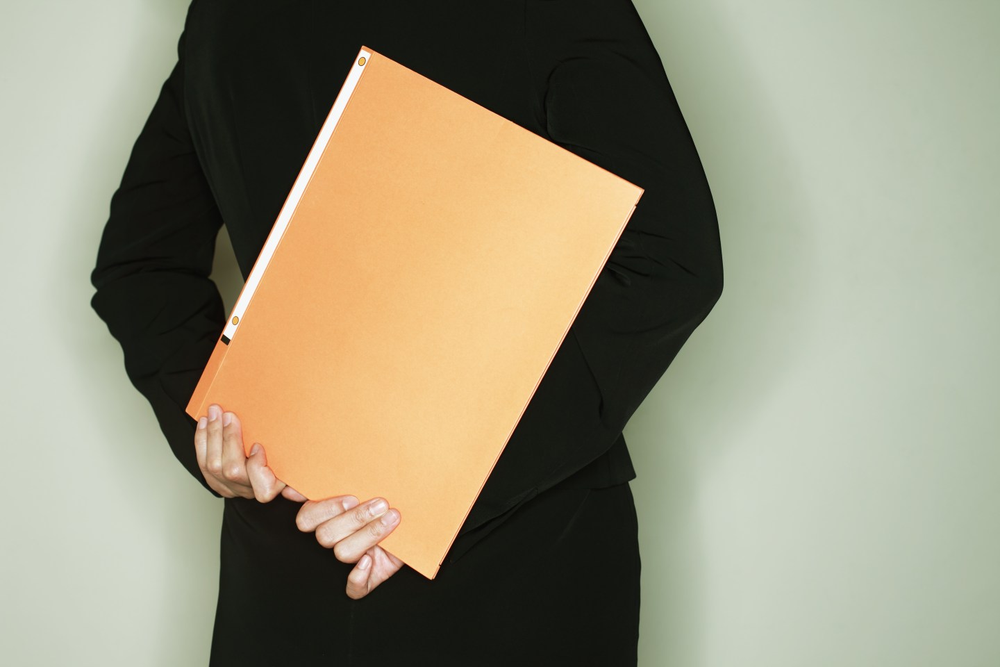 midle age businesswoman with a binder,rear view