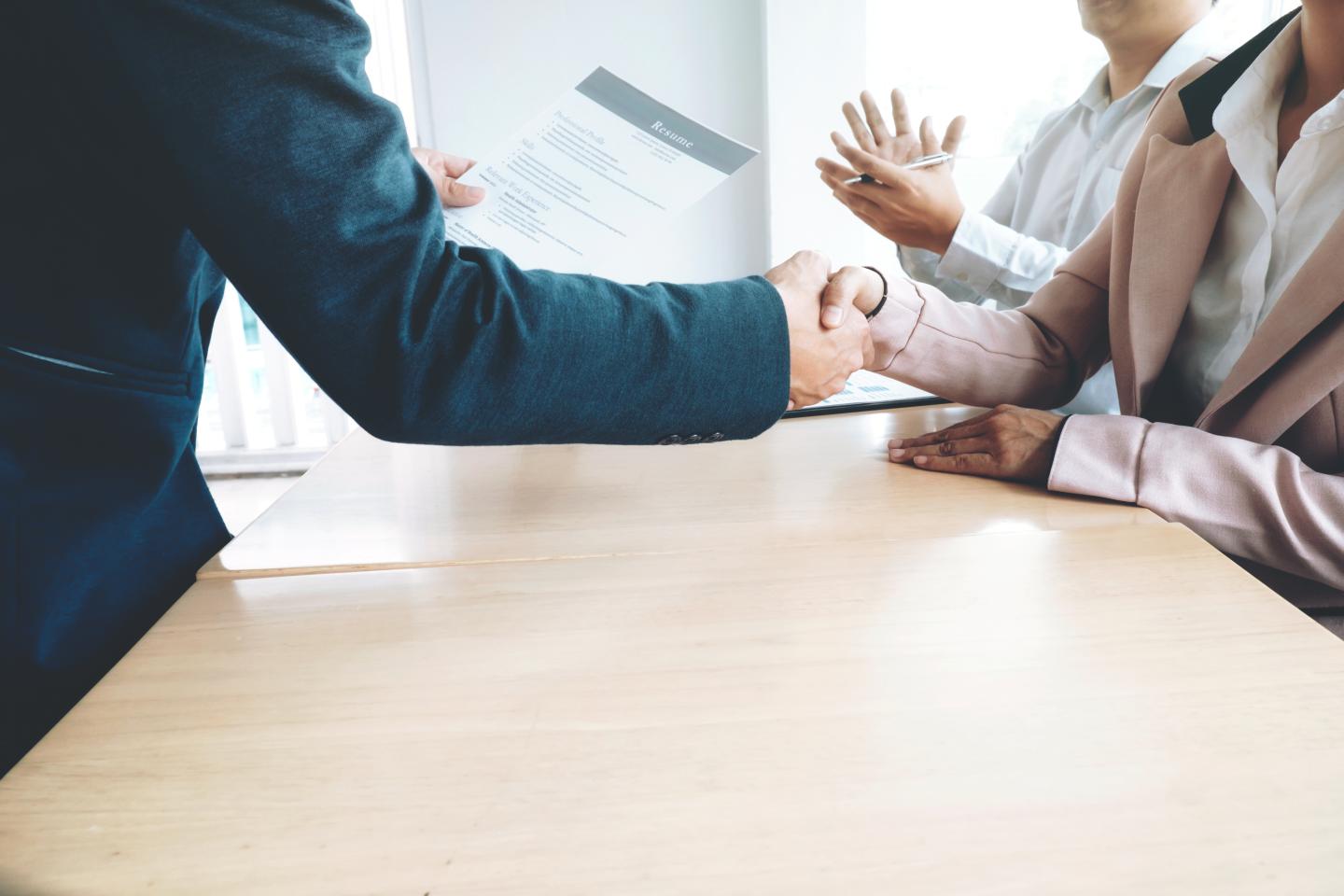 Successful job interview. Boss and new employee handshaking