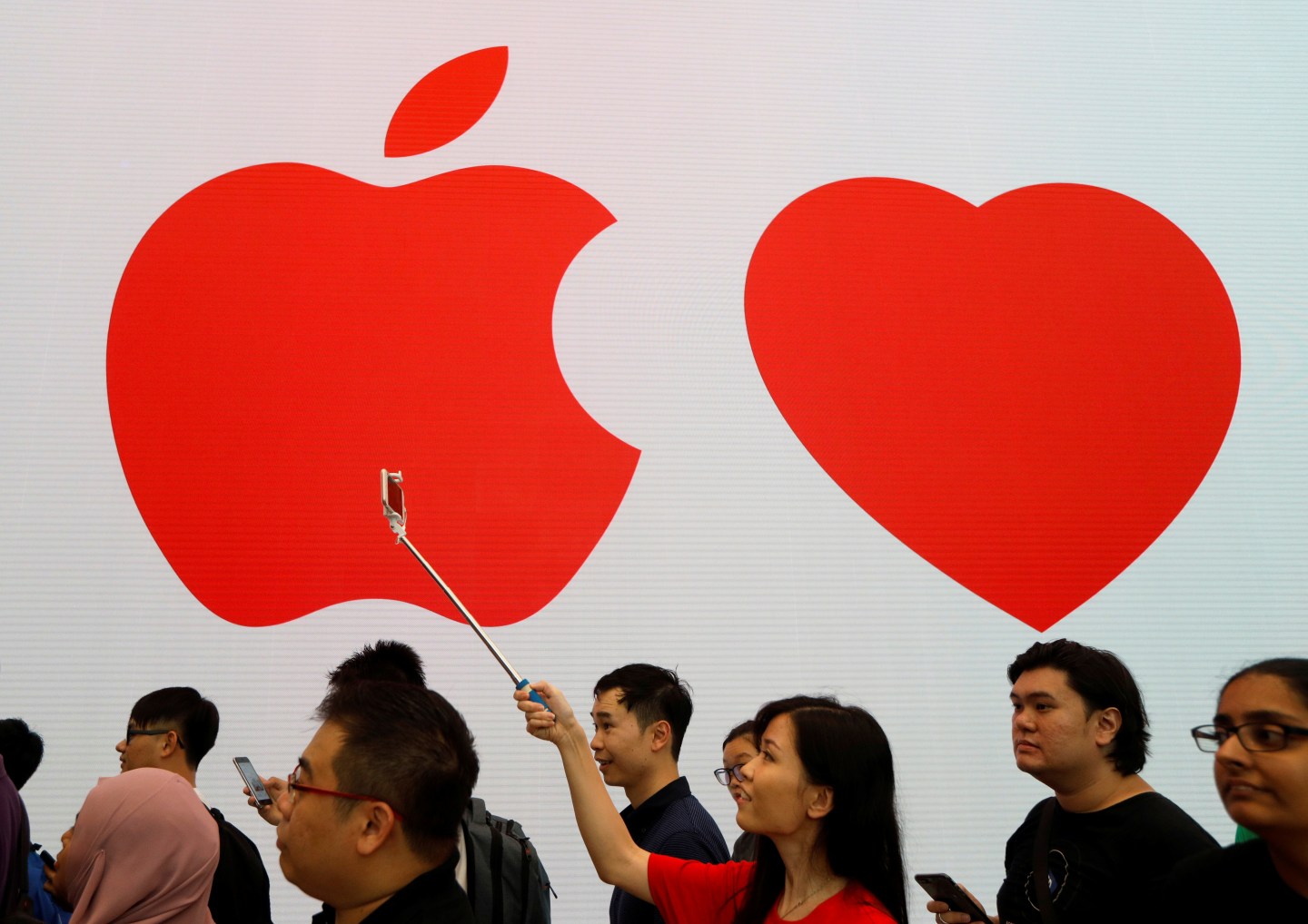 People visit the city-state's first Apple Store on its opening day at Orchard Road, Singapore