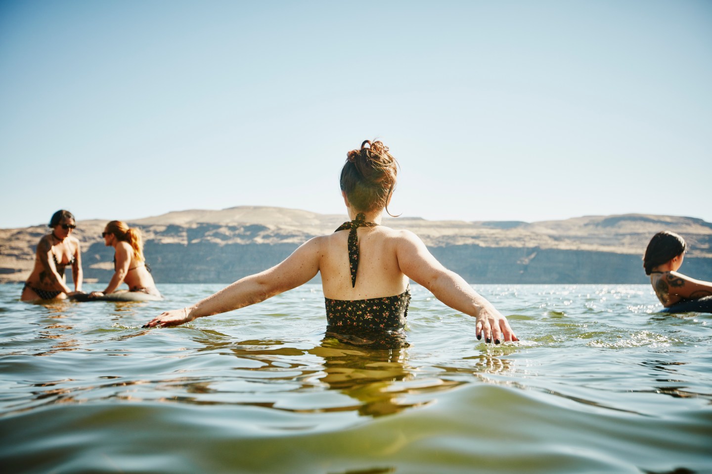 Group of women playing in river