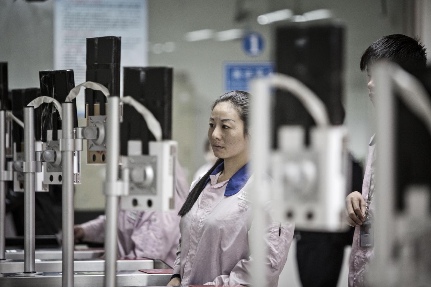 Workers Inside The Pegatron Corp. Factory in Shanghai