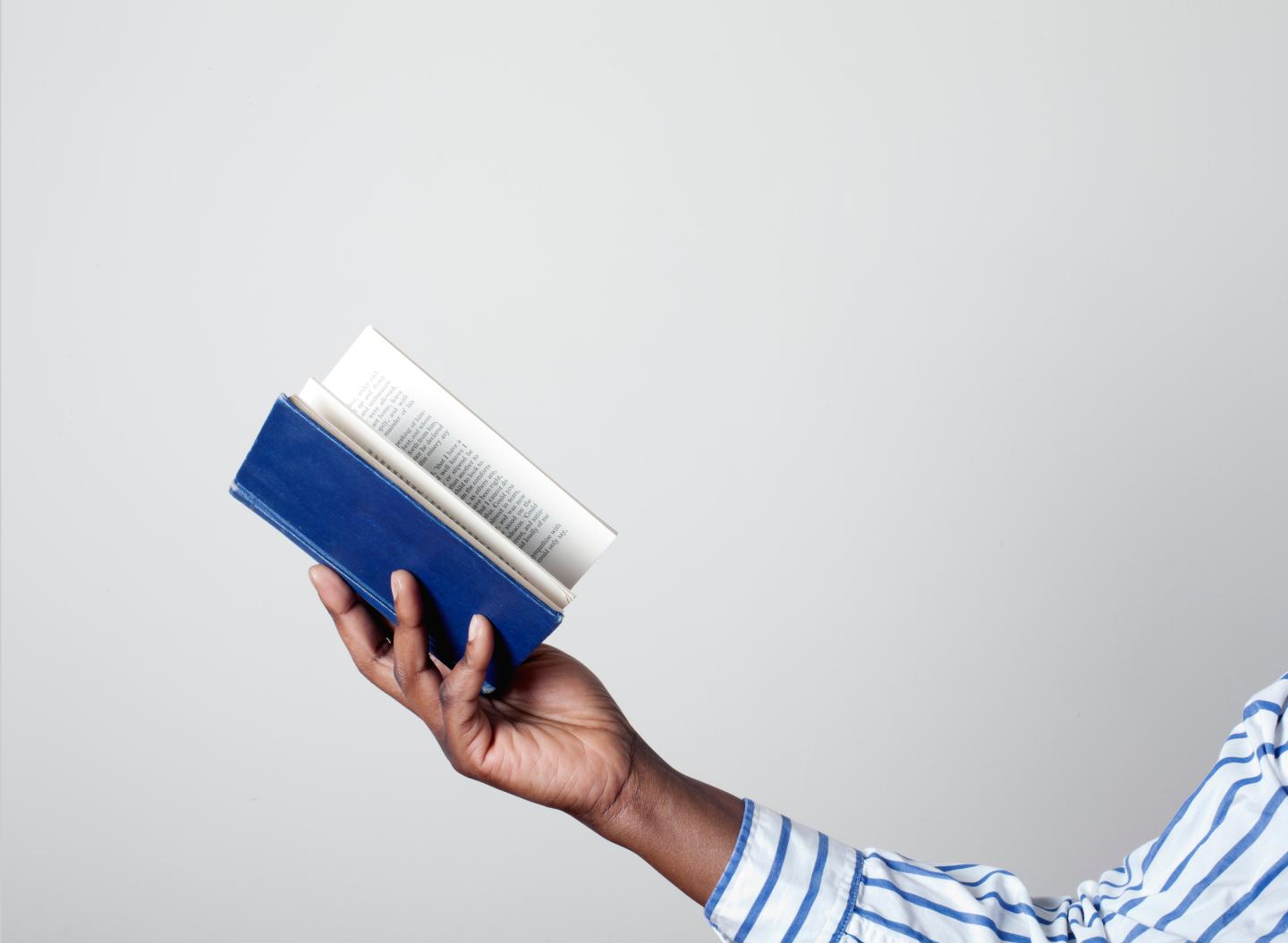 Hand holding book