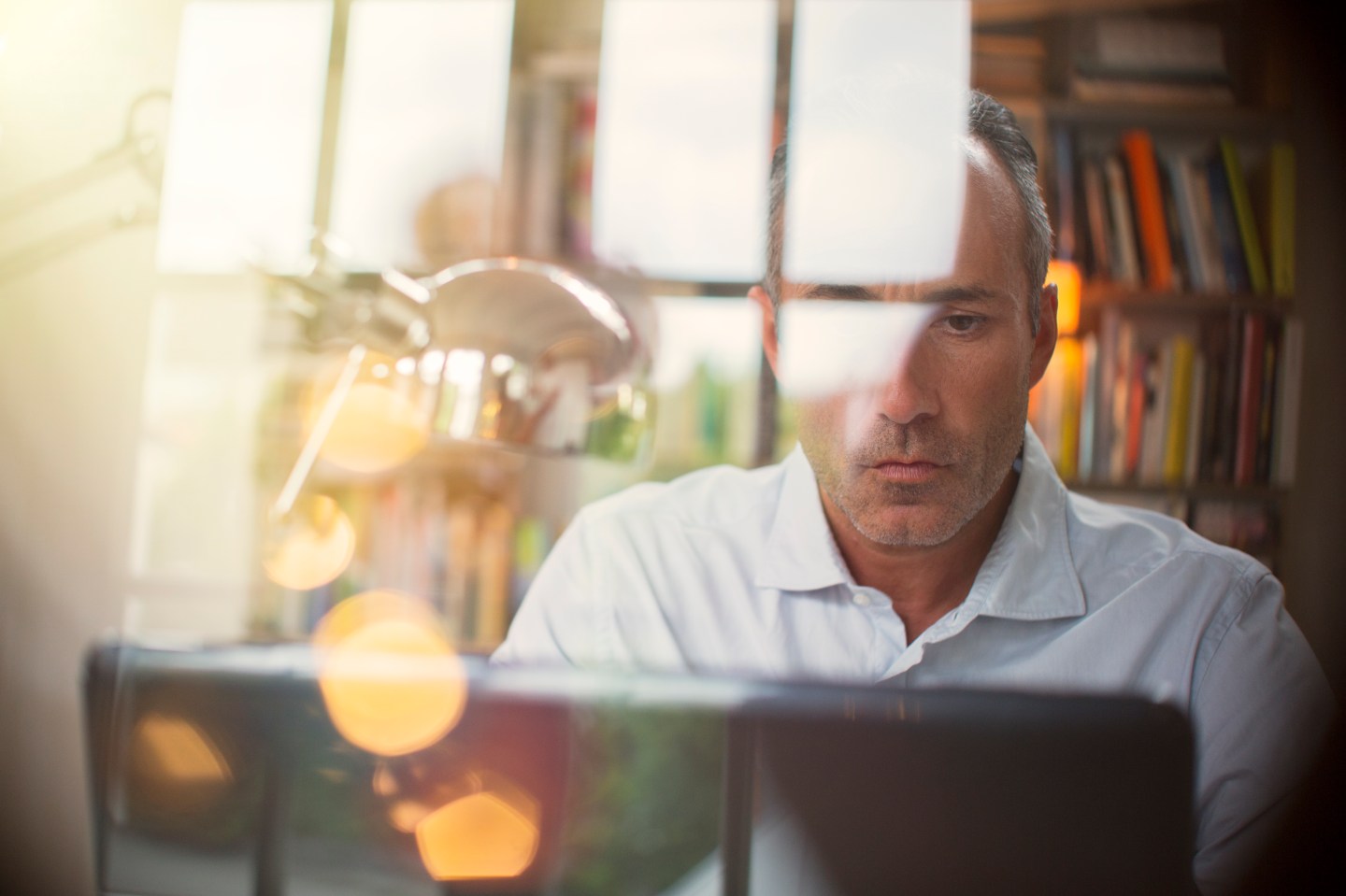 Businessman using laptop in home office