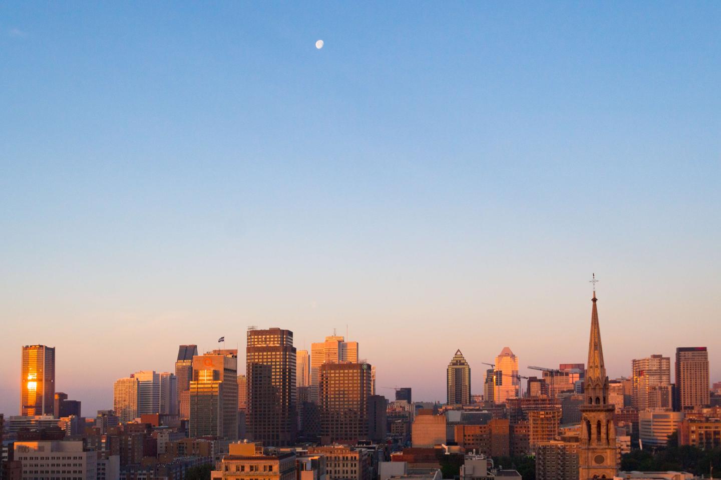 City skyline with moon in the sky. The famous Canadian city