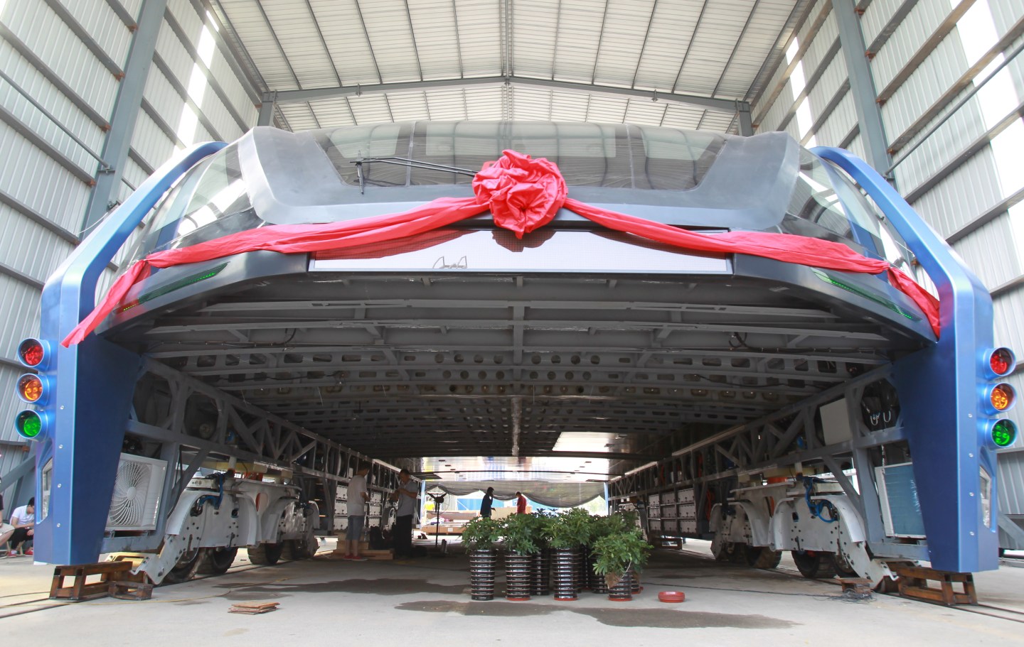 A model of a innovative street-straddling bus called Transit Elevated Bus is seen after a test run in Qinhuangdao, Hebei Province, China