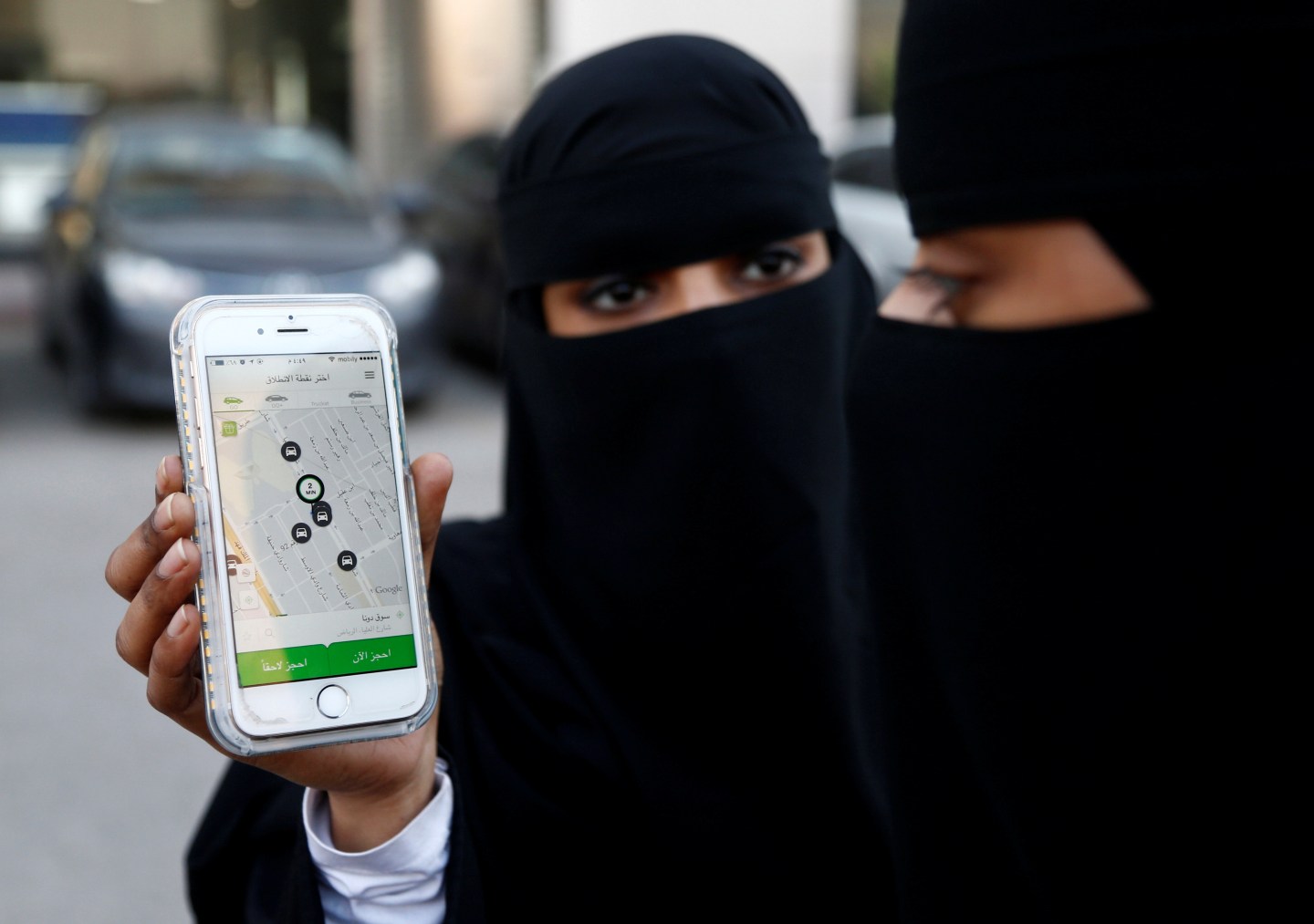 Saudi woman shows the Careem app on her mobile phone in Riyadh