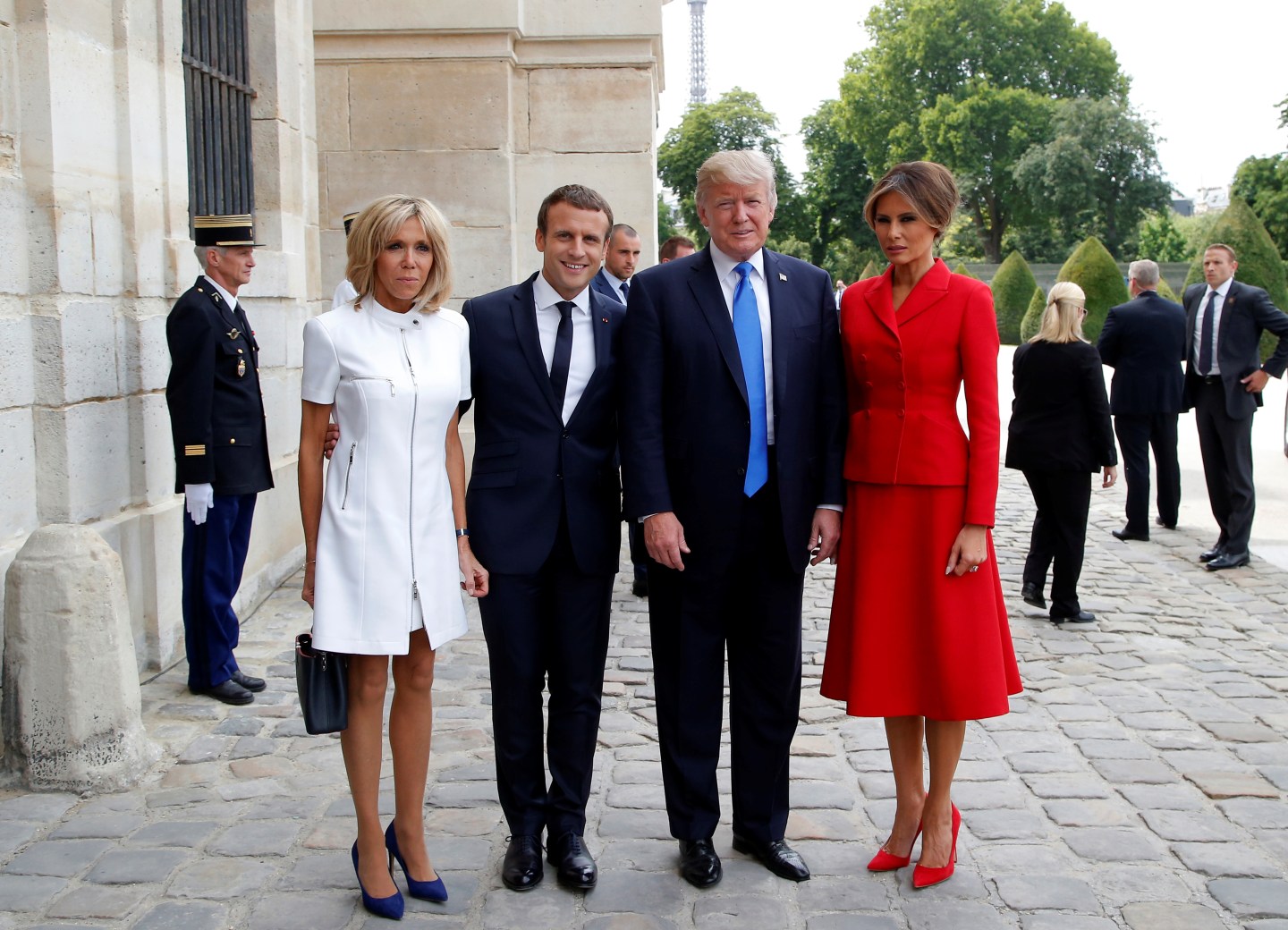 French President Emmanuel Macron and his wife Brigitte pose with US President Donald Trump and First Lady Melania Trump at Les Invalides museum in Paris