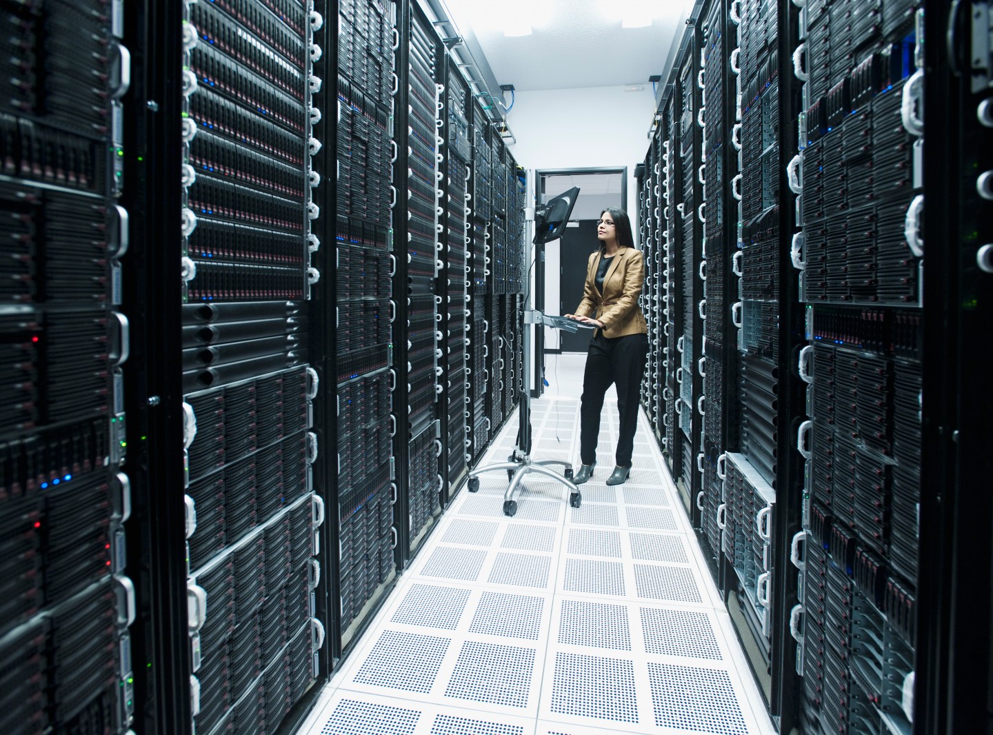 Business people working in server room