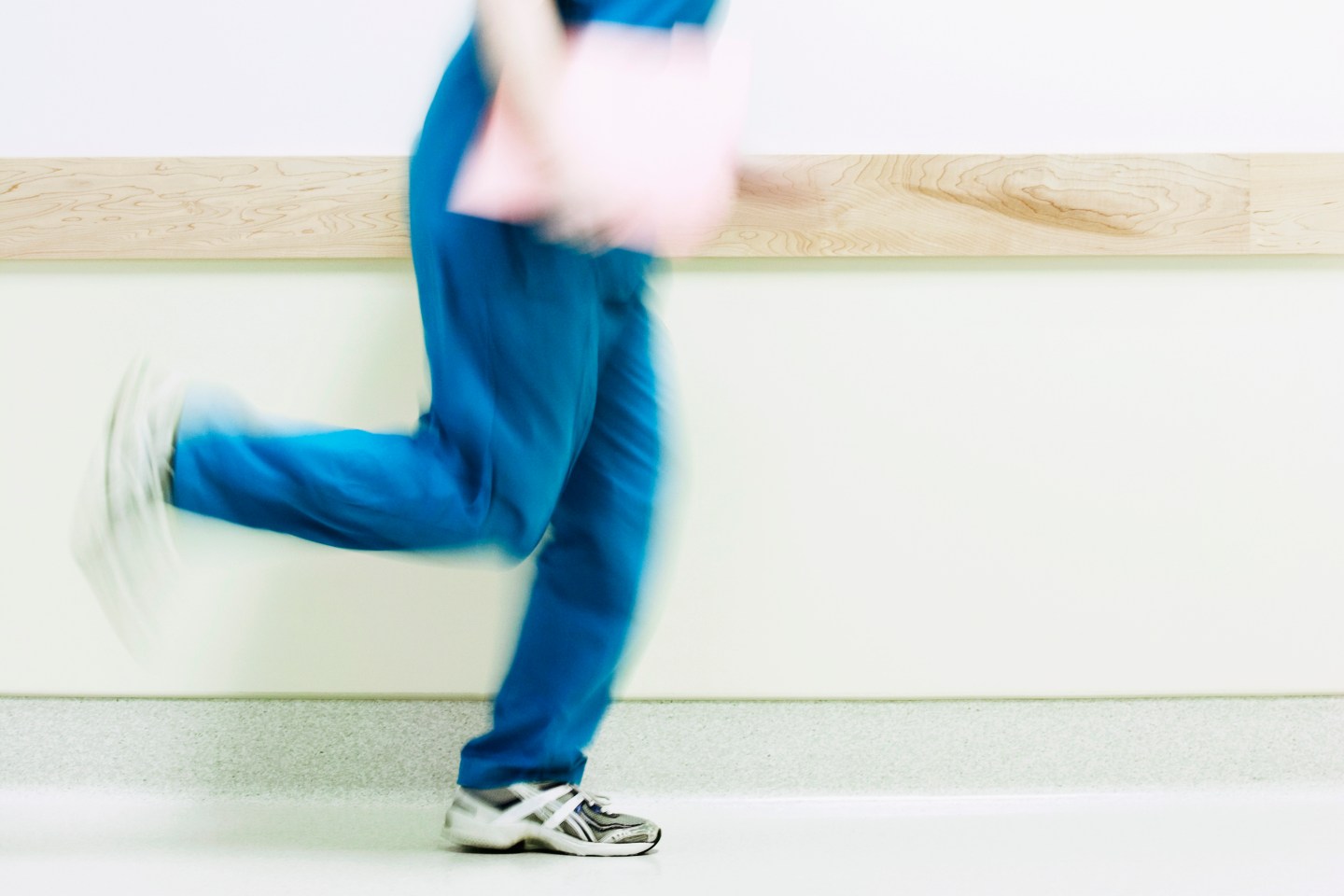 Female nurse running in a hospital