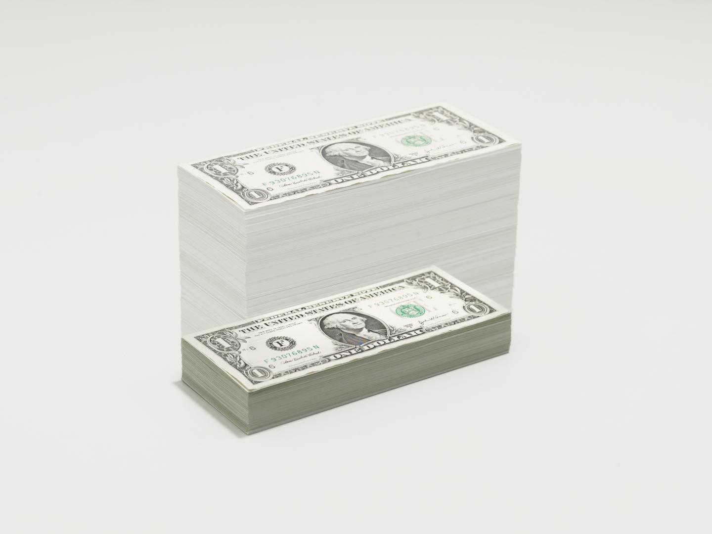 A growing pile of dollar bills