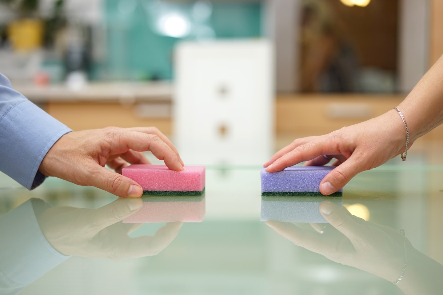husband and wife cleaning home together