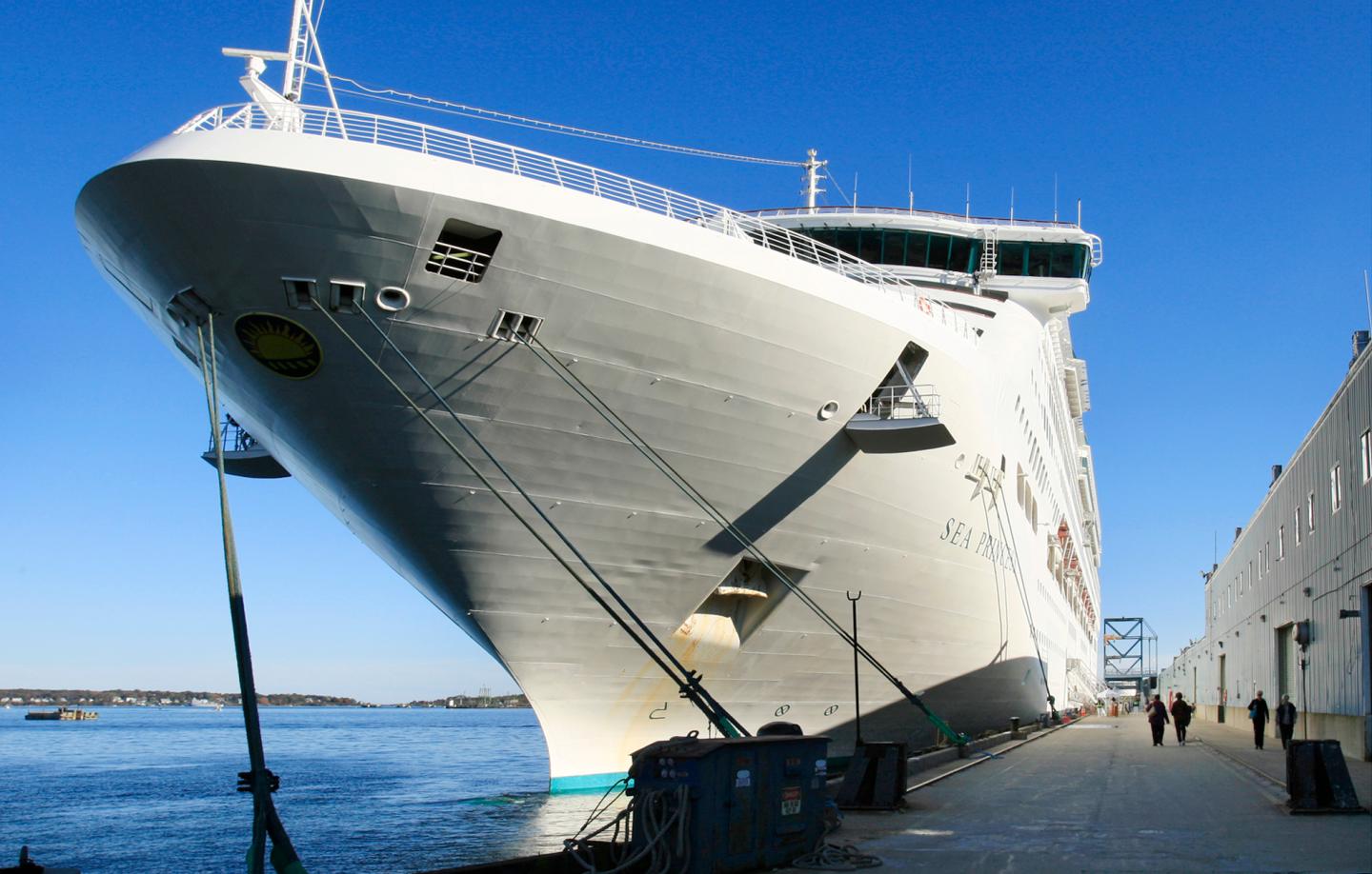 Passengers return to the cruise ship Sea Princess tied up at the Portland Ocean Terminal at the end