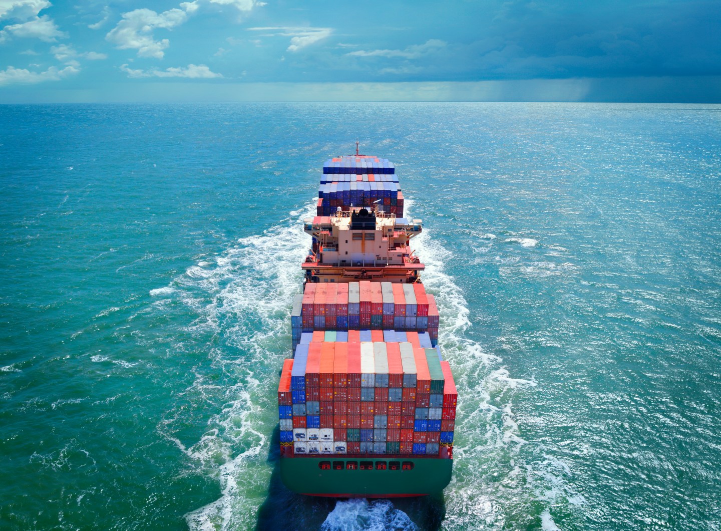 Aerial view of freight ship with cargo containers