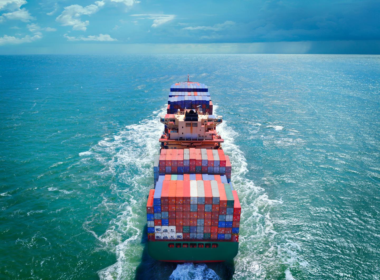 Aerial view of freight ship with cargo containers
