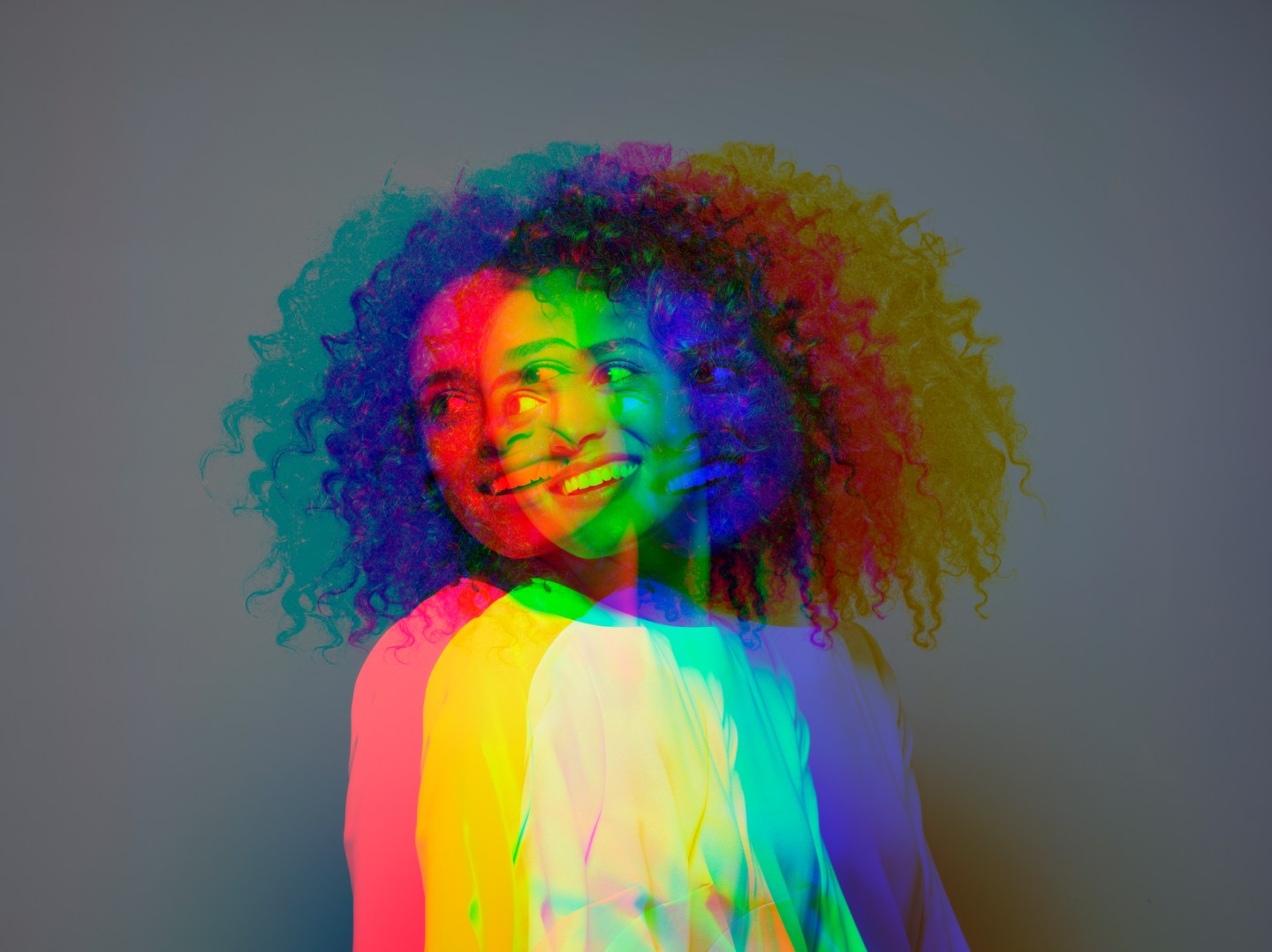 Multiple exposure,dark skinned female smiling
