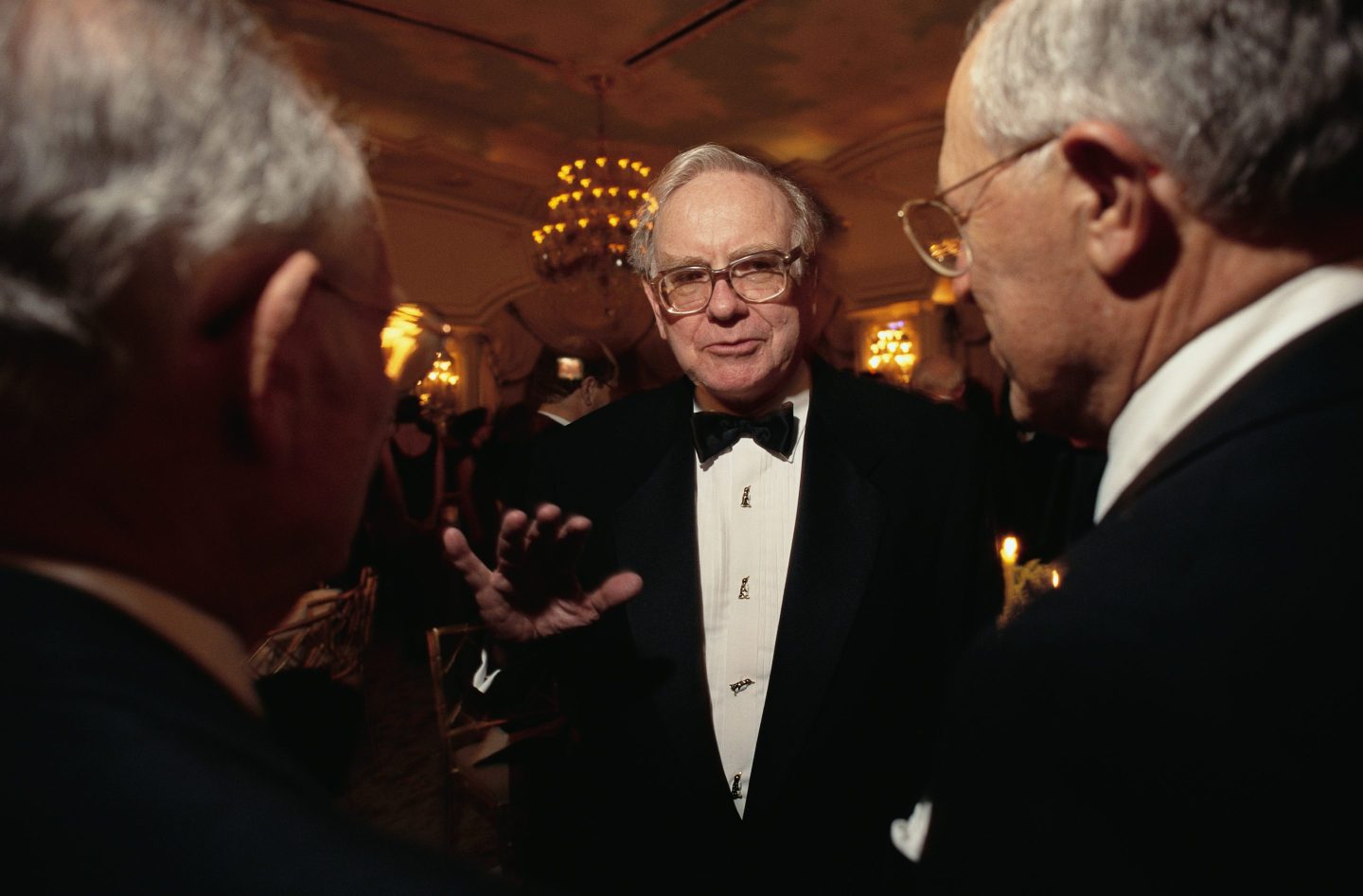 CEO Warren Buffett Conversing at Formal Event