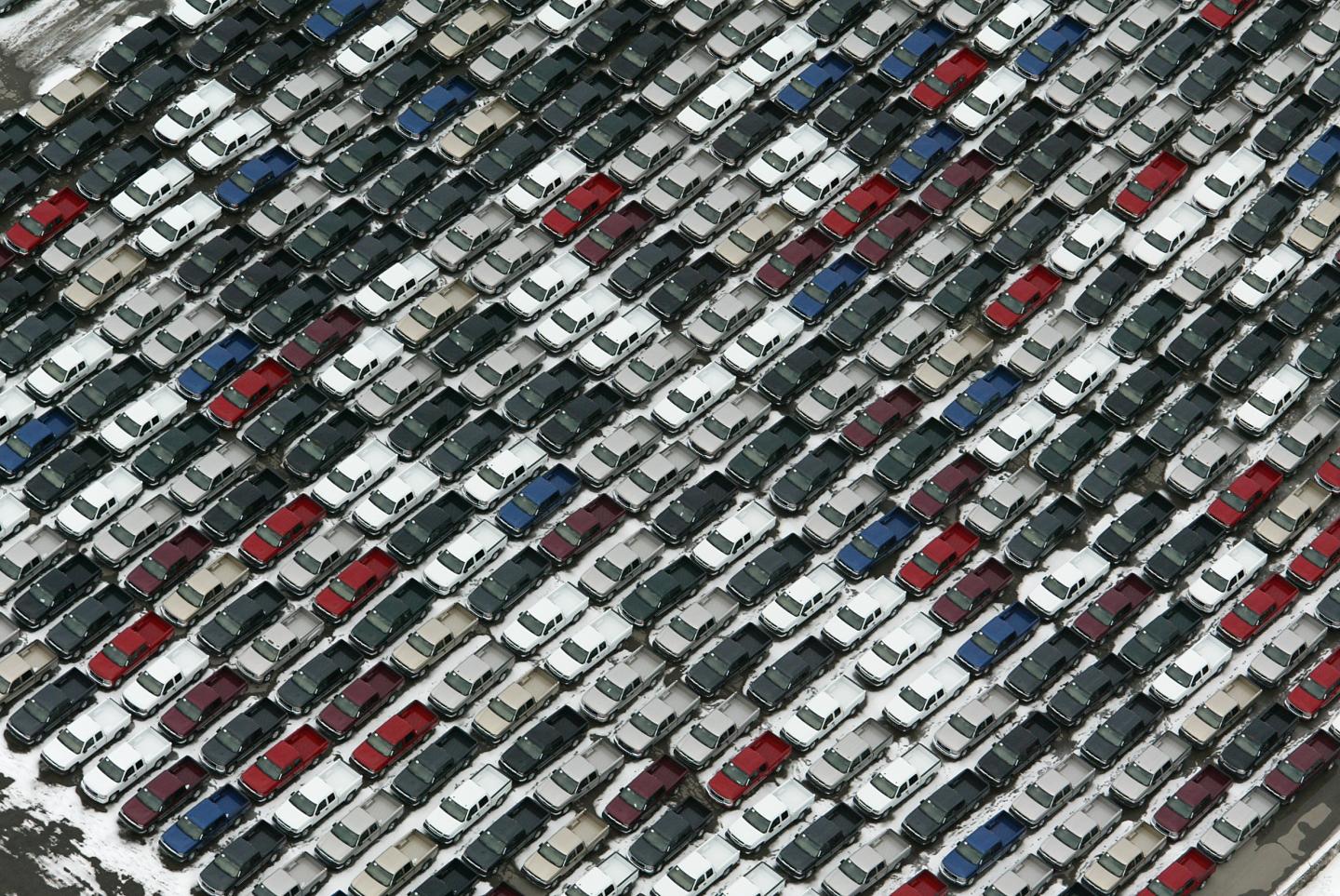 A Sea of new pickup trucks are parkied around GM Oshawa which is filling up with new cars and trucks