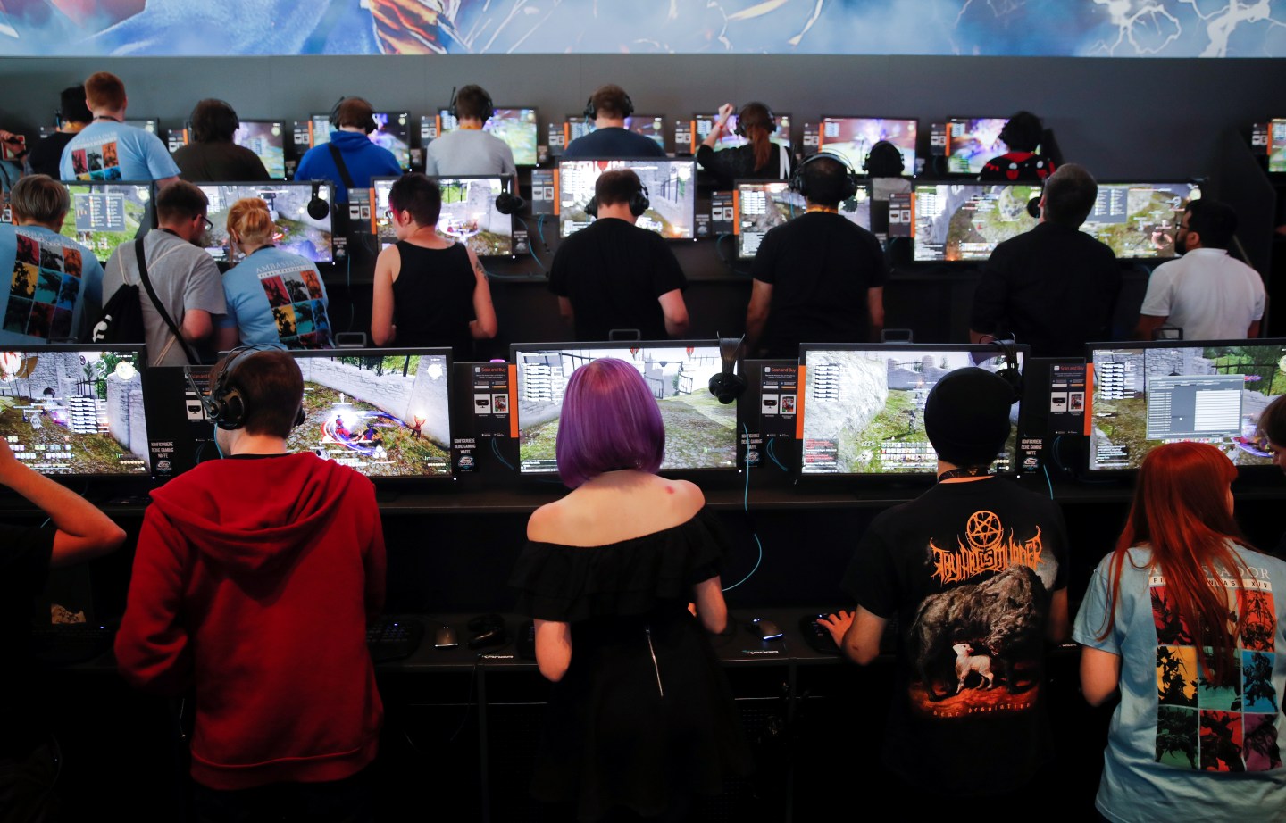 Gamers play video games during the opening of the world's largest computer games fair Gamescom in Cologne