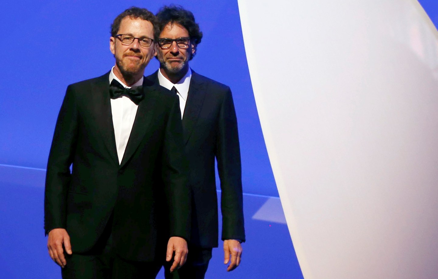 American writer and director brothers Joel and Ethan Coen, Jury Presidents of the 68th Cannes Film Festival, arrive on stage during the opening ceremony at the 68th Cannes Film Festival in Cannes