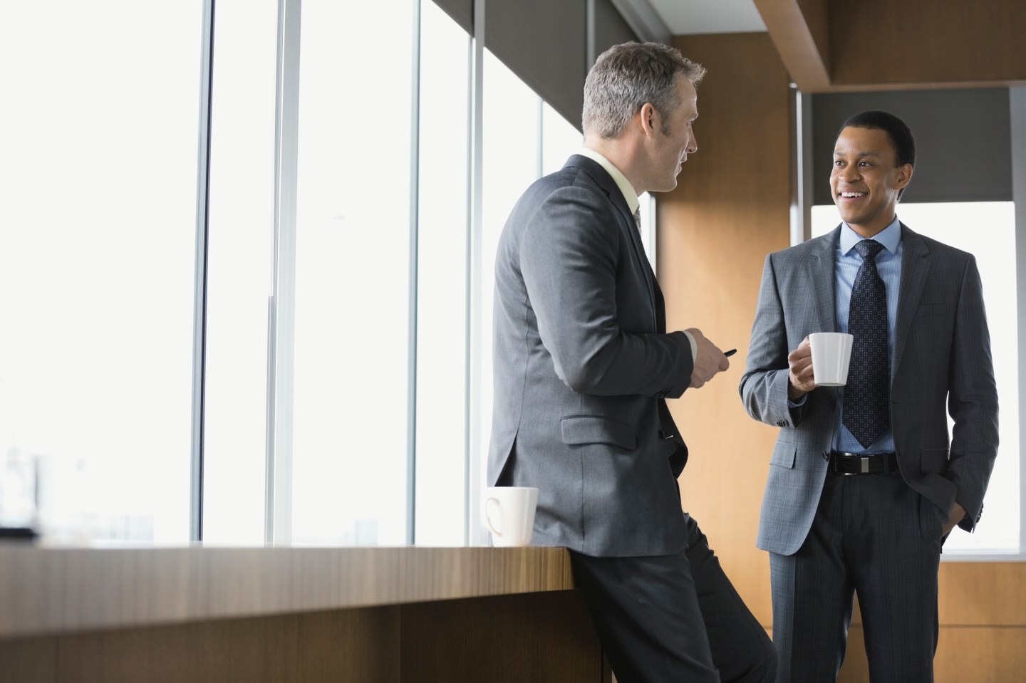 Businessmen talking in conference room