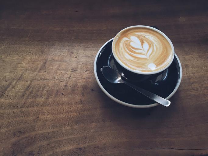 High Angle View Of Cappuccino On Wooden Table