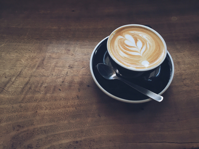 High Angle View Of Cappuccino On Wooden Table