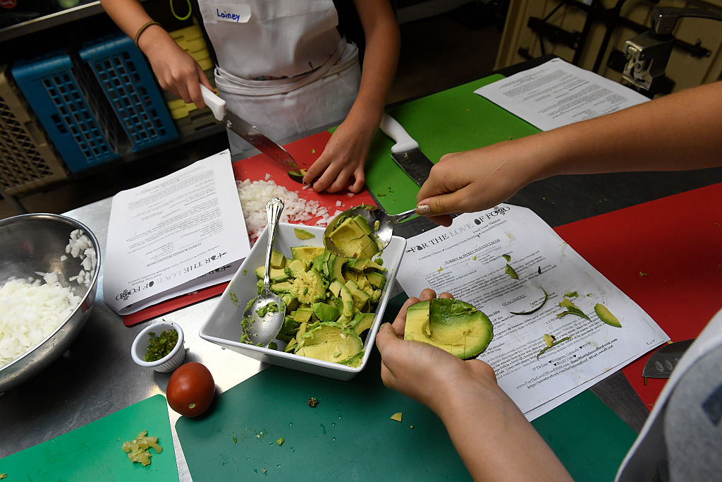 Kids participate in Kids Cook cooking classes with local chef Diane Bukatman and her cooking company called For The Love of Food in Golden, Colorado