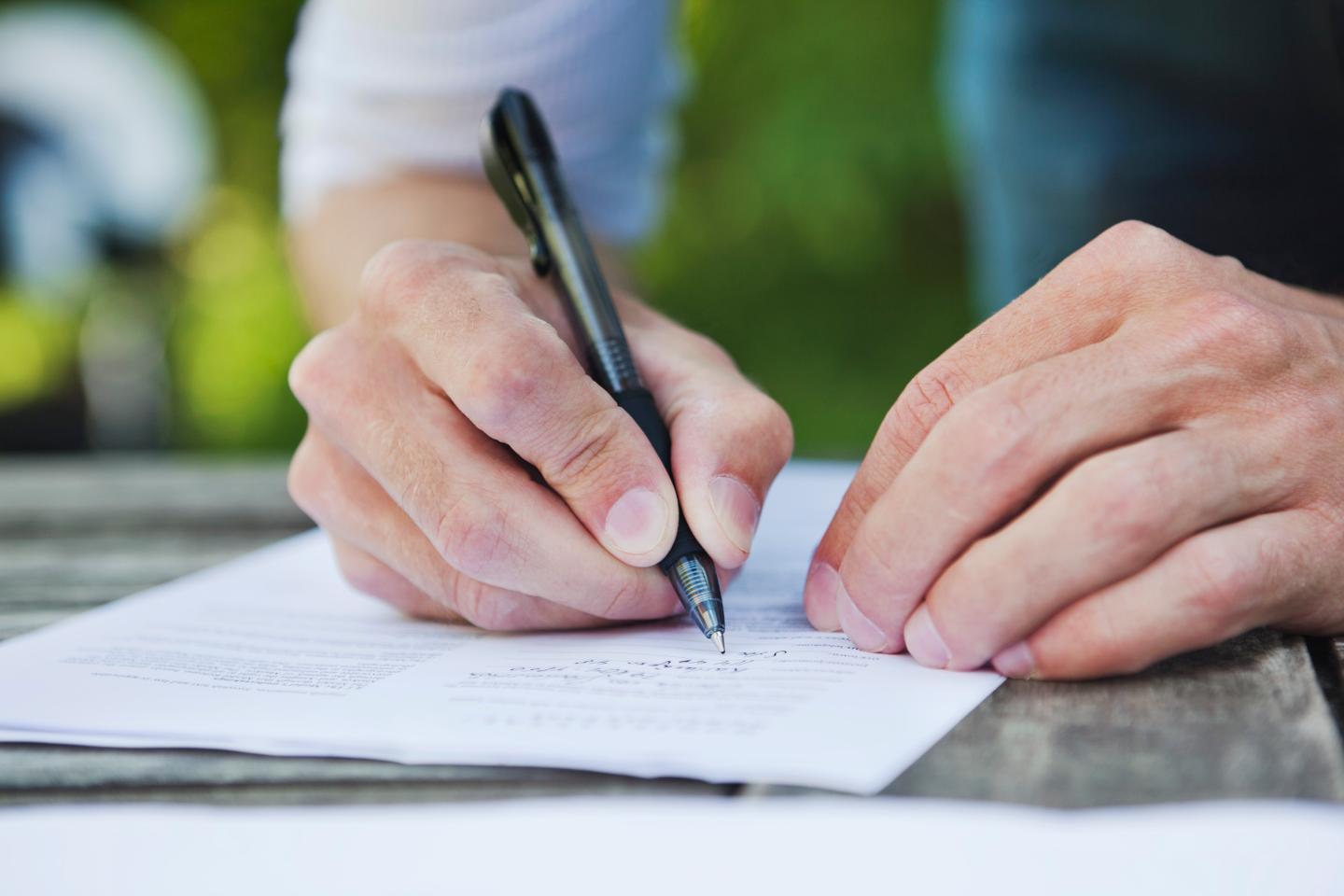 Man writing on paper