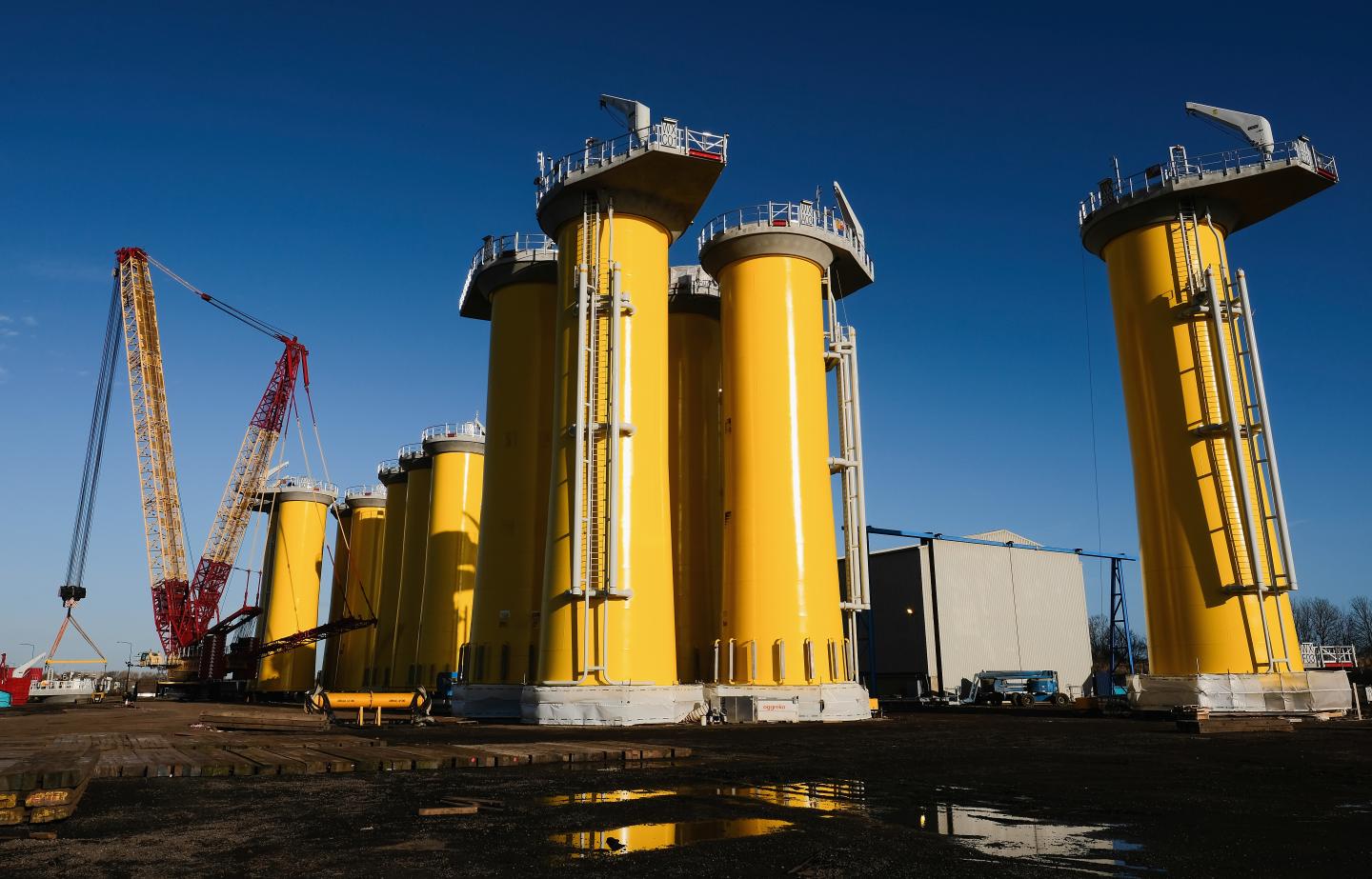Wind Turbine Transition Pieces Lined Up For Transport