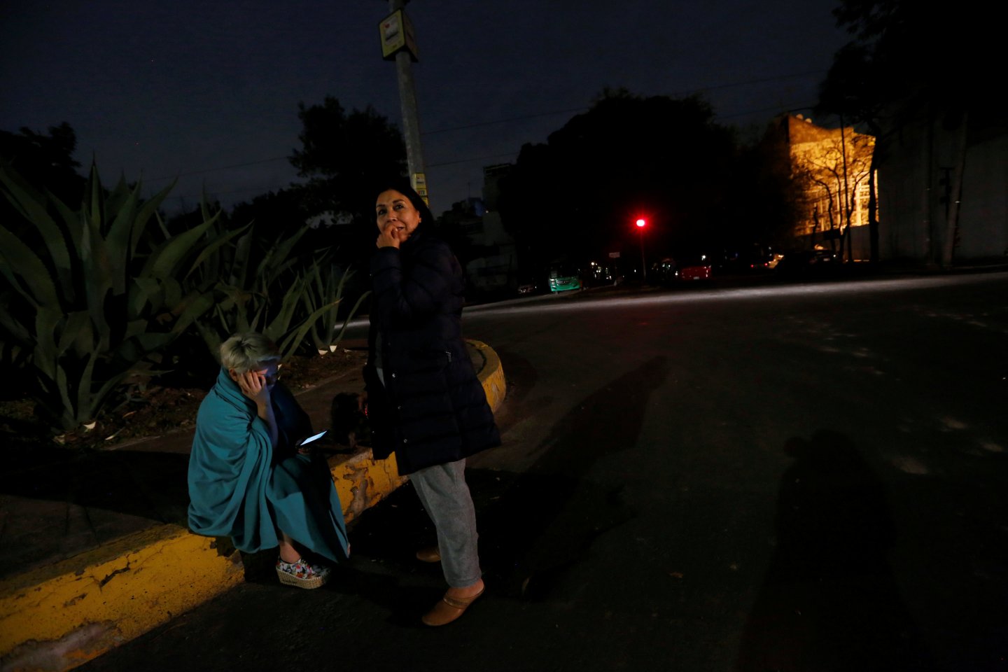 People gather on a street after an earthquake hit Mexico City