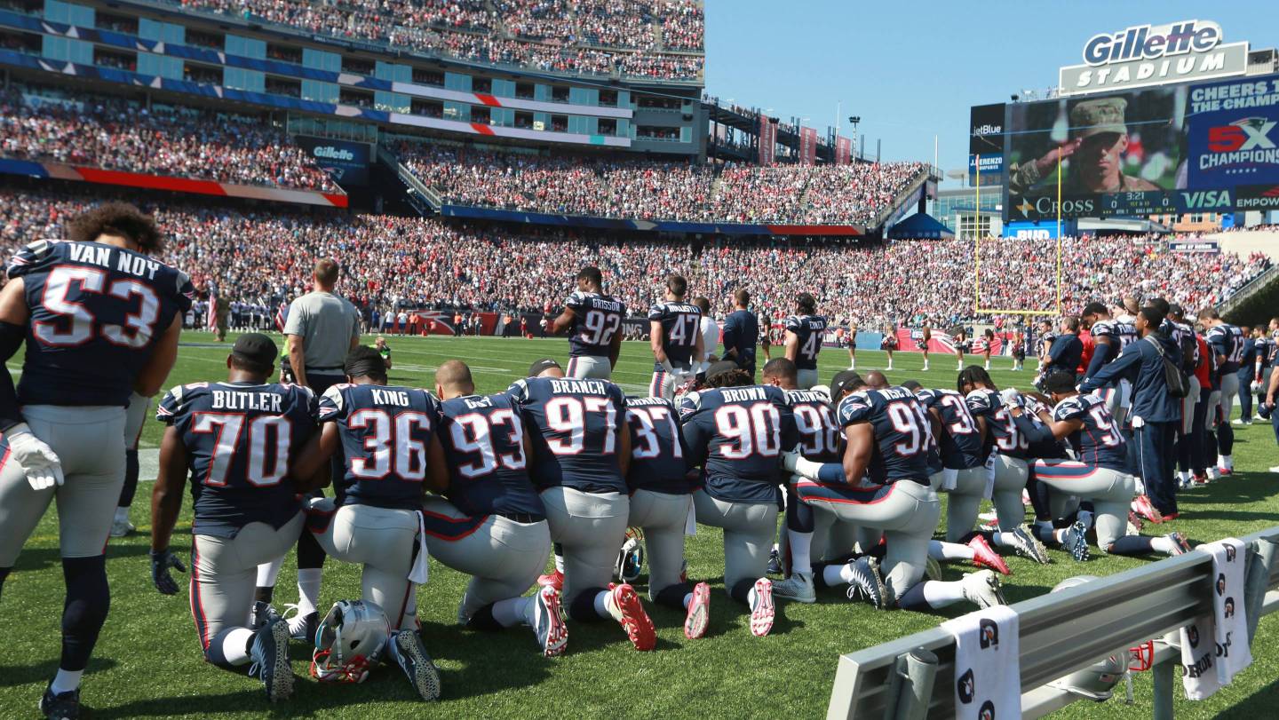 New England Patriots players take a knee during the national anthem before the start of a game against the Houston Texans at Gillette Stadium in Foxborough, Mass., Sept. 24, 2017.