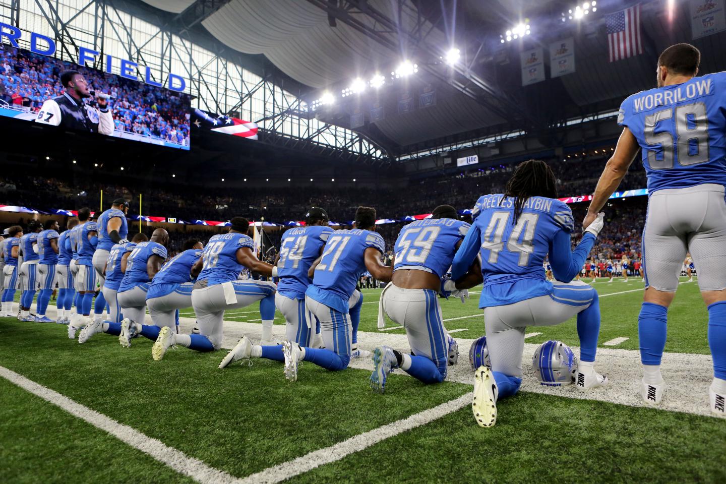 Members of the Detroit Lions take a knee during the playing of the national anthem prior to the start of the game against the Atlanta Falcons at Ford Field on September 24, 2017 in Detroit, Michigan.