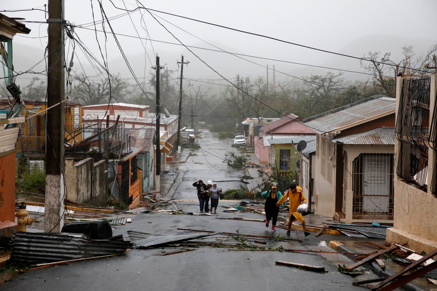 Rescue workers help people after the area was hit by Hurricane Maria in Guayama