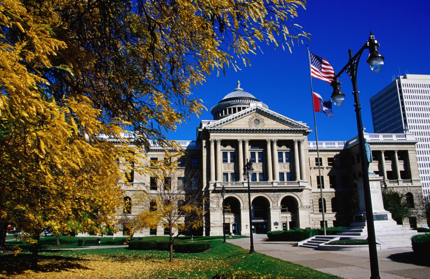 American flag flying in front of Lucas County Courthouse.