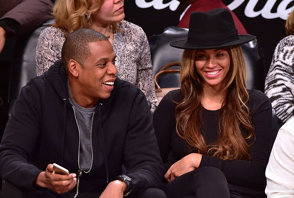 NEW YORK, NY - JANUARY 12:  Jay-Z and Beyonce Knowles attend the Houston Rockets vs Brooklyn Nets game at Barclays Center on January 12, 2015 in New York City.  (Photo by James Devaney/GC Images)