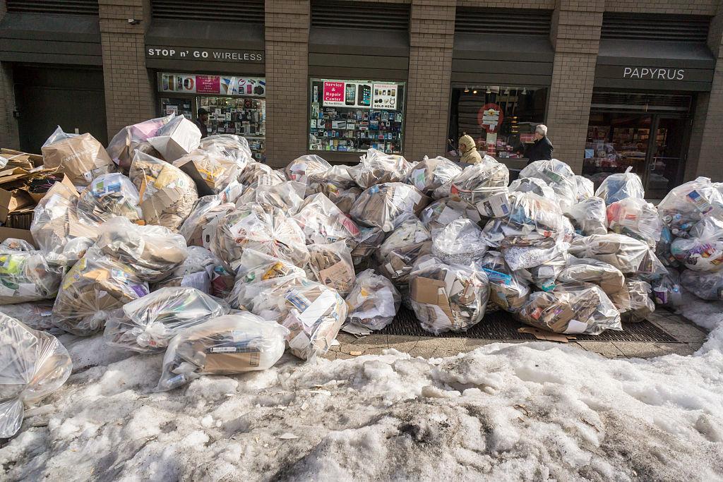 Trash accumulates and awaits pick-up in New York