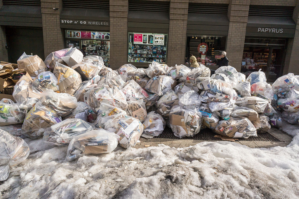 Trash accumulates and awaits pick-up in New York