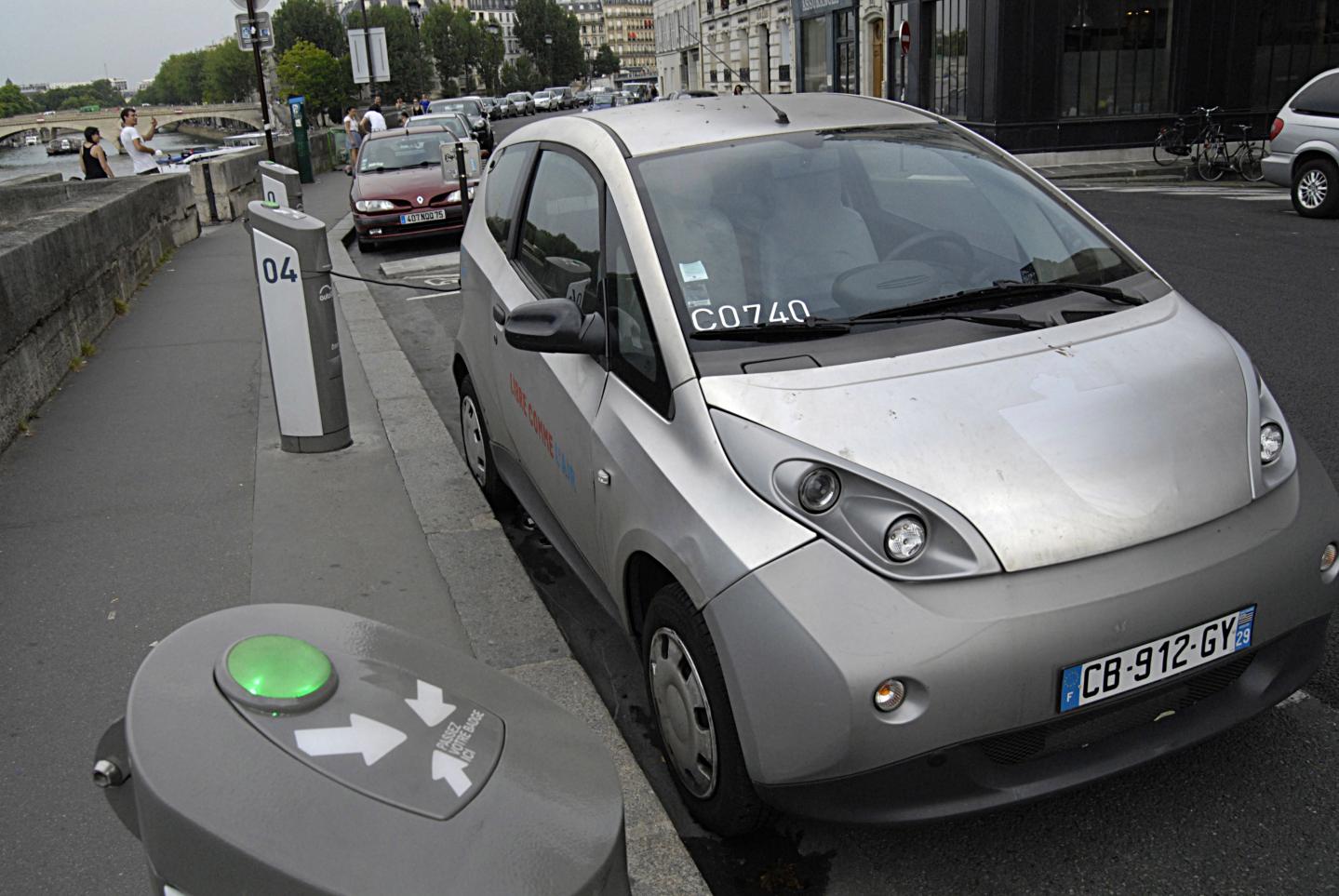 Hybrid car parked at recharge station at autolib