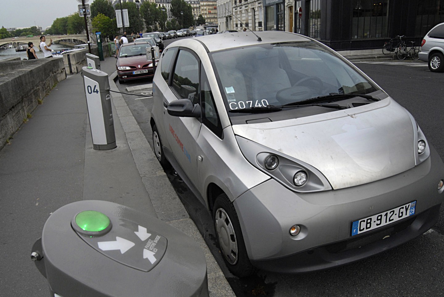 Hybrid car parked at recharge station at autolib