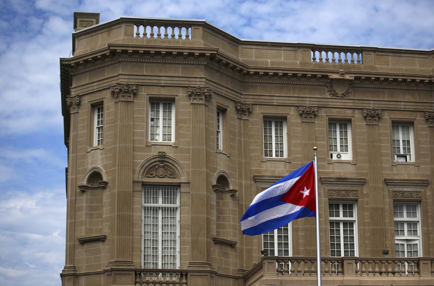 FILE PHOTO - Cuban national flag is seen raised over their new embassy in Washington