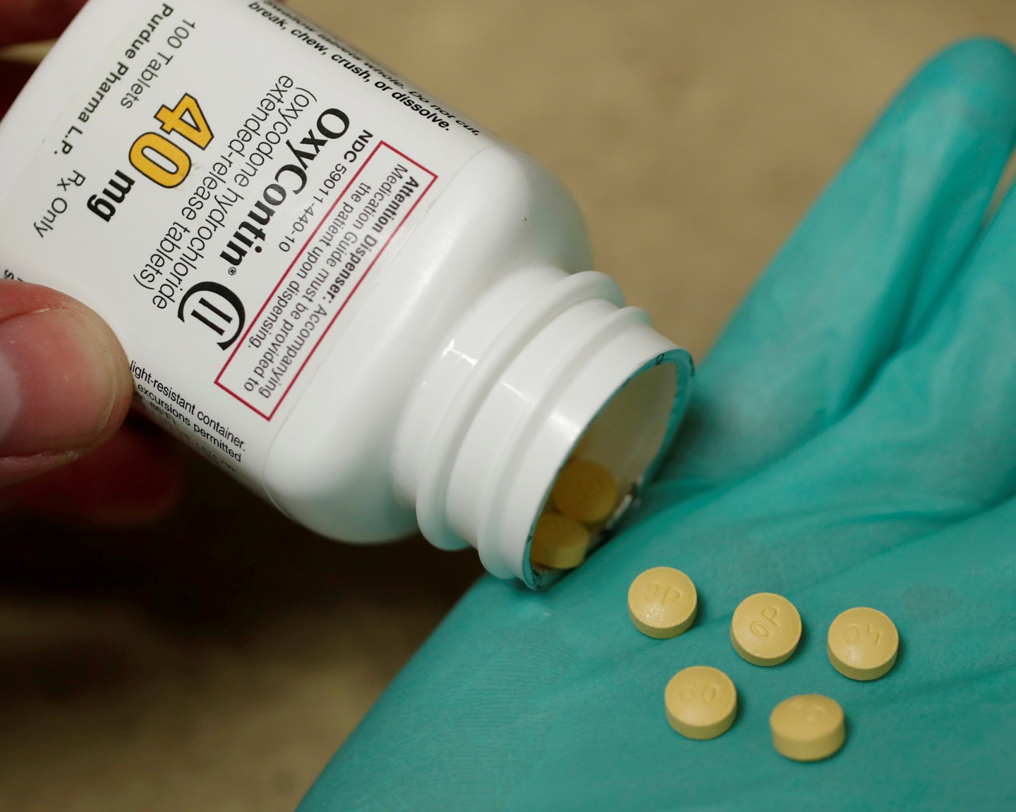 FILE PHOTO: A pharmacist holds prescription painkiller OxyContin at a local pharmacy in Provo