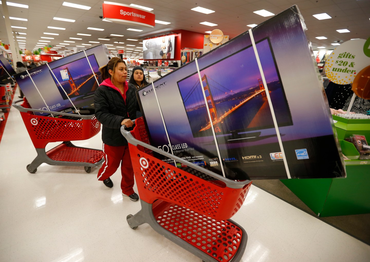 Thanksgiving Day holiday shoppers line up with discounted television sets at the Target retail store in Chicago