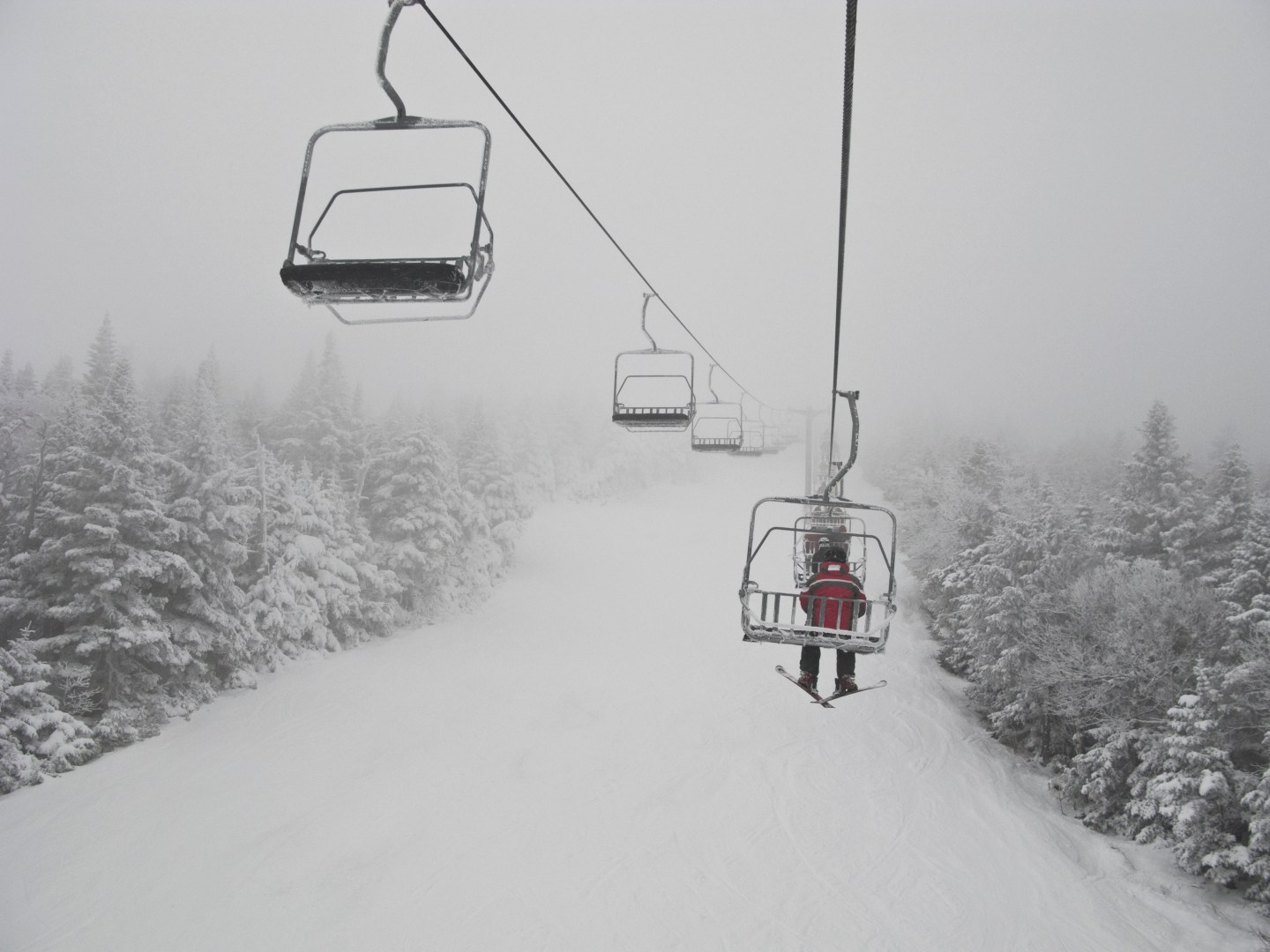 USA, Vermont, Killington, Skier on chair lift