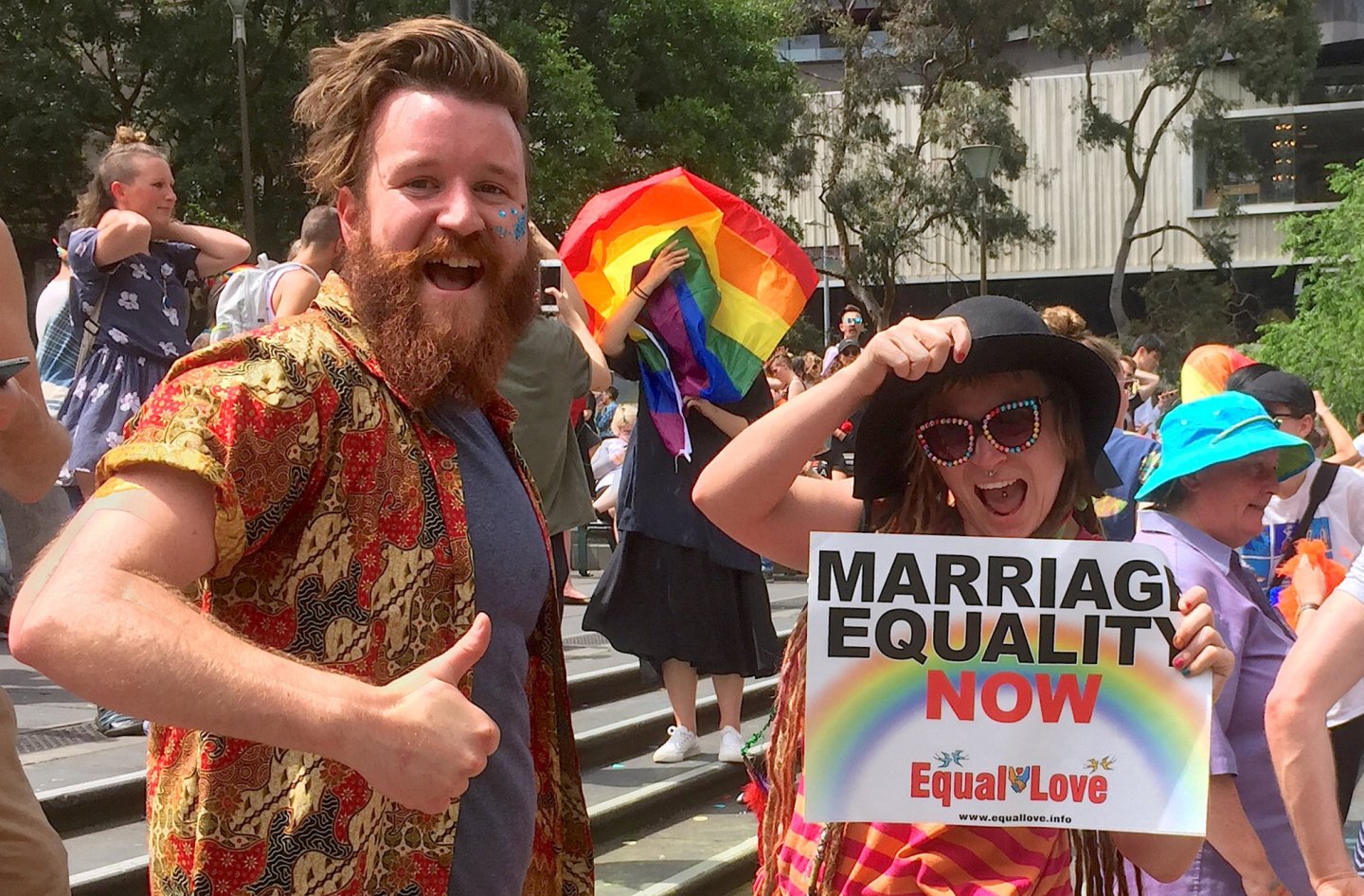 Supporters of the 'Yes' vote react as they celebrate after it was announced the majority of Australians support same-sex marriage in a national survey, at a rally in Sydney
