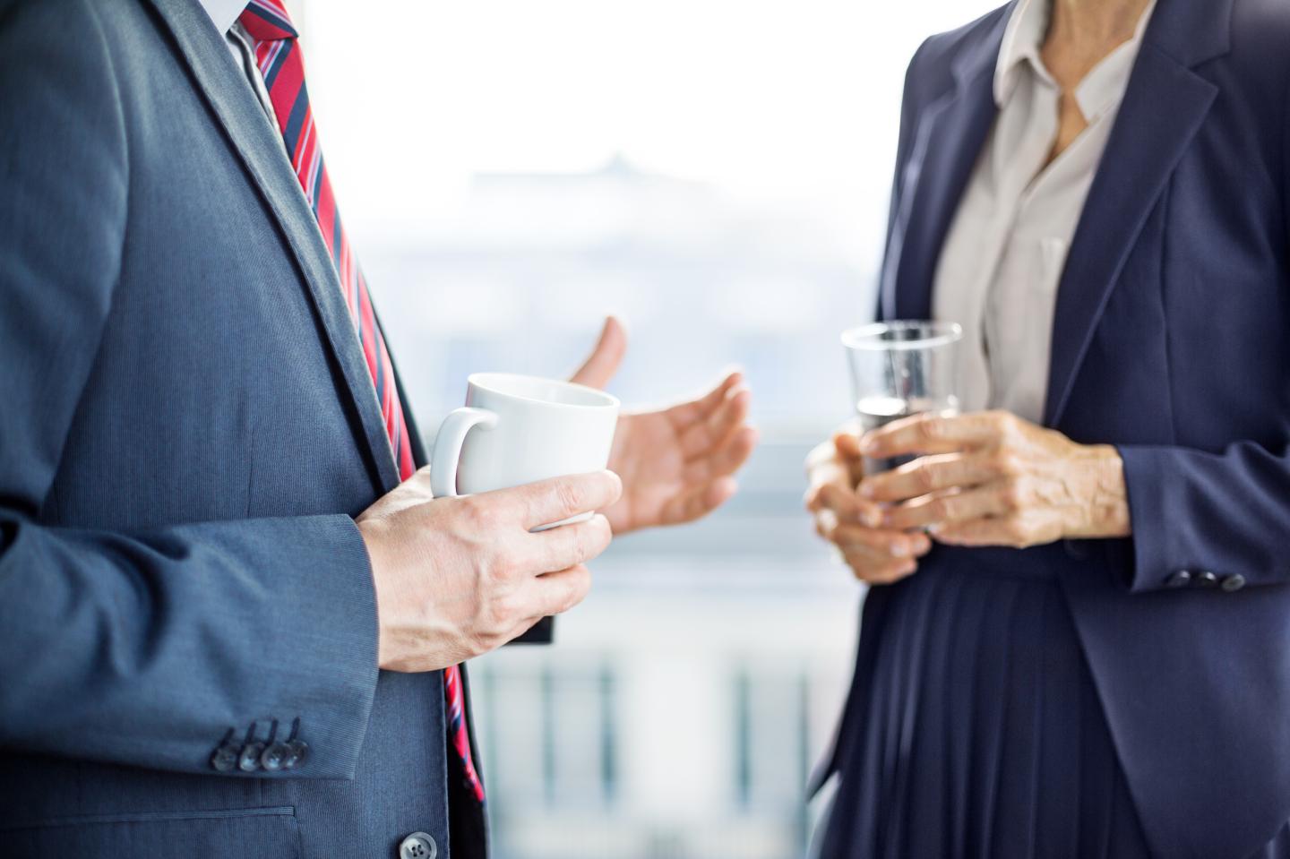 Business partners having a discussion during coffee break