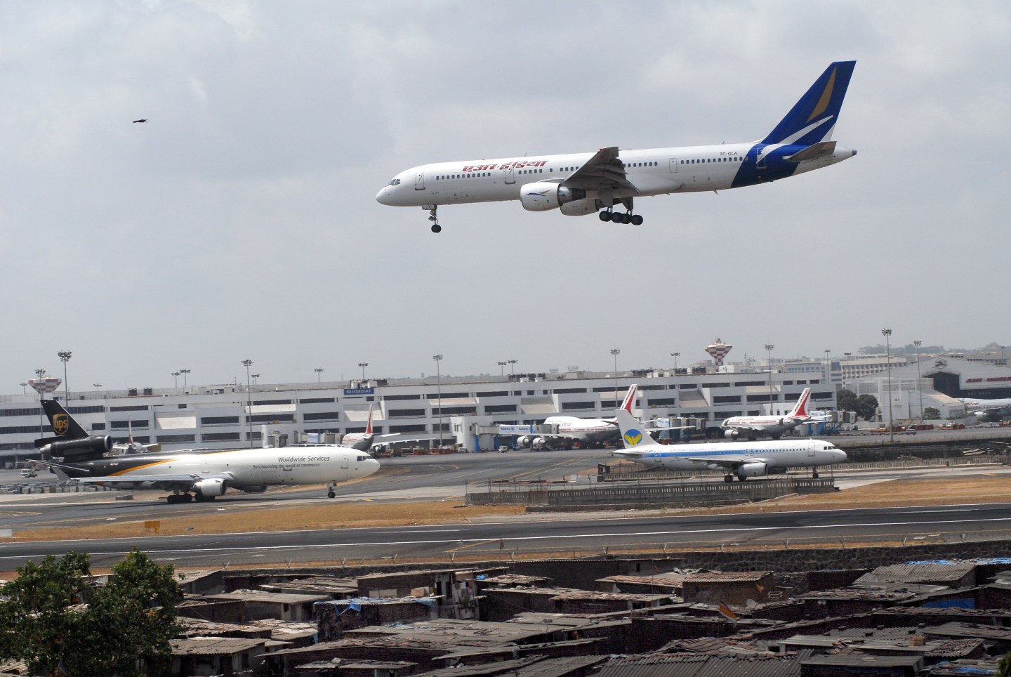 Indian Airlines commercial airliner preparing to land at Chhatrapati Shivaji International Airport in Mumbai, Maharashtra, India.
