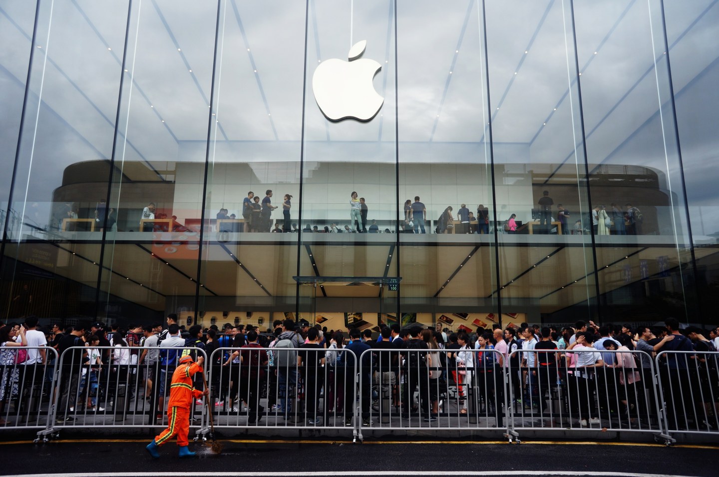 People line up outside an Apple store in China ahead of the iPhone 7 launch