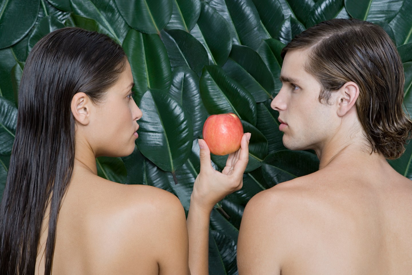 Woman giving man an apple